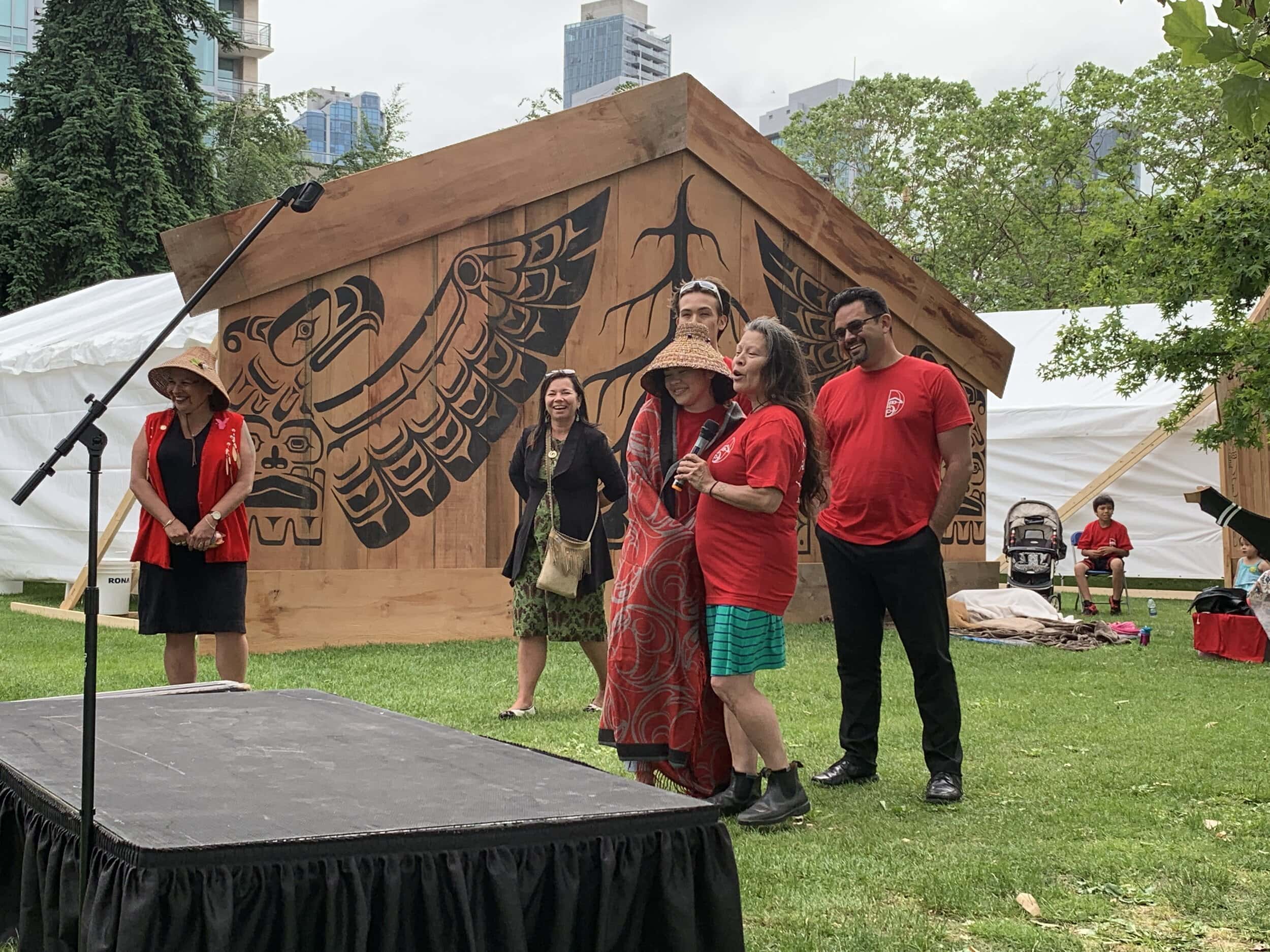 Ta’Kaiya Blaney (in centre with cedar woven hat) and Eli Enns (behind wearing sunglasses) at the Longhouse Dialogues in Vancouver BC, June 2019 for the #WomenHonourCanoe ceremony.Photo © IISAAK OLAM Foundation